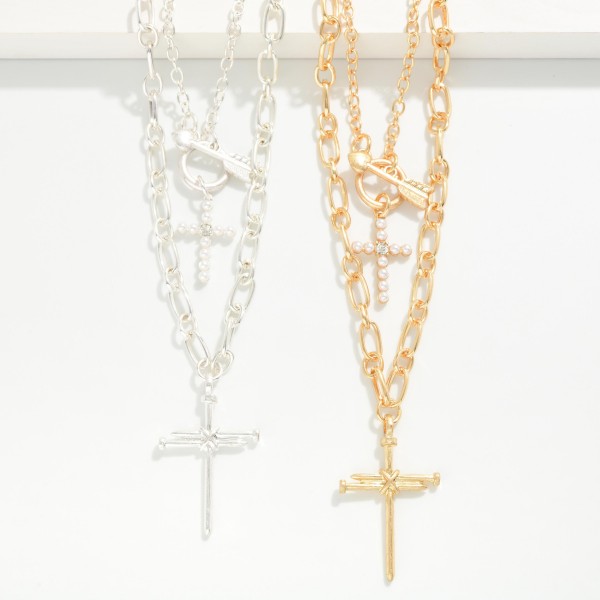 Double Layer Cross Necklace pairing a sparkling chain with a toggle accent and petite cross over a bold figaro chain with a larger cross pendant. Already layered for a polished stacked look, with an extender to adjust the fit. Made for Christmas, Easter, Sunday service and everyday faith style. Two crosses on one easy piece means a quick yes from shoppers at the counter.