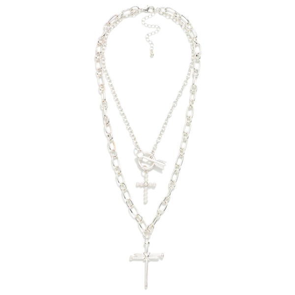 Double Layer Cross Necklace pairing a sparkling chain with a toggle accent and petite cross over a bold figaro chain with a larger cross pendant. Already layered for a polished stacked look, with an extender to adjust the fit. Made for Christmas, Easter, Sunday service and everyday faith style. Two crosses on one easy piece means a quick yes from shoppers at the counter.