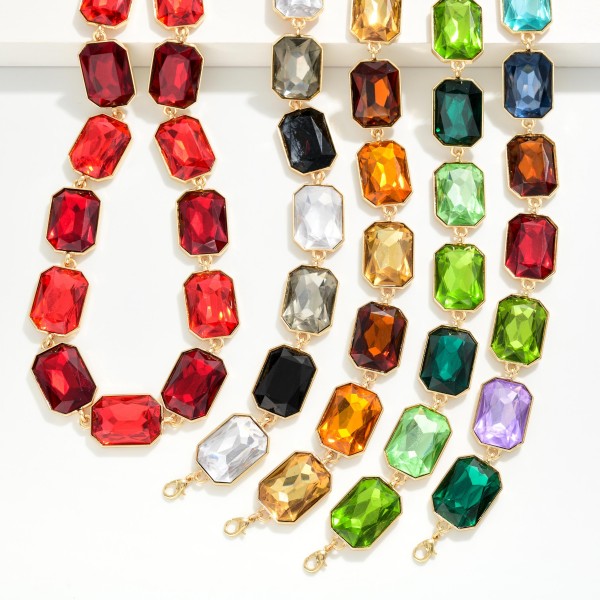 Emerald Cut Crystal Statement Necklace made of oversized faceted stones linked stone to stone in polished prong settings. The bold collar silhouette sits right at the neckline and finishes with a lobster clasp and extender. A showstopper for holiday parties, galas, weddings and New Year's Eve. Big glam at an approachable price, perfect for front table displays that stop shoppers in their tracks.