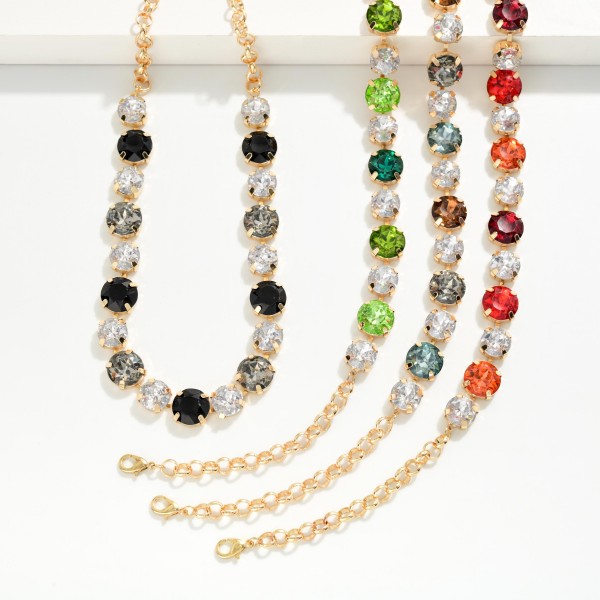 Crystal Statement Necklace with round faceted stones set in polished bezels and alternated with sparkling rhinestone accents on a classic link chain. It sits at the collarbone with an adjustable extender, so it frames any neckline from crew to V neck. A favorite for holiday parties, weddings, date nights and dressing up a simple sweater. Bold sparkle at an easy price point makes it a reliable seller for any boutique jewelry wall.