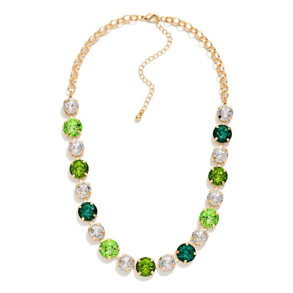 Crystal Statement Necklace with round faceted stones set in polished bezels and alternated with sparkling rhinestone accents on a classic link chain. It sits at the collarbone with an adjustable extender, so it frames any neckline from crew to V neck. A favorite for holiday parties, weddings, date nights and dressing up a simple sweater. Bold sparkle at an easy price point makes it a reliable seller for any boutique jewelry wall.