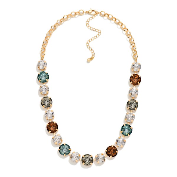 Crystal Statement Necklace with round faceted stones set in polished bezels and alternated with sparkling rhinestone accents on a classic link chain. It sits at the collarbone with an adjustable extender, so it frames any neckline from crew to V neck. A favorite for holiday parties, weddings, date nights and dressing up a simple sweater. Bold sparkle at an easy price point makes it a reliable seller for any boutique jewelry wall.