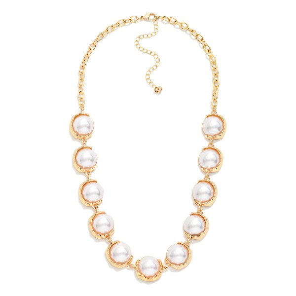 Pearl Bezel Statement Necklace with glossy faux pearl cabochons set in polished bezels and linked along a classic chain. It sits at the collarbone with an extender for easy sizing and pairs with everything from sweaters to party dresses. An elegant pick for holiday events, weddings, church and the office. Timeless pearl styles sell to every age and make an easy gift.