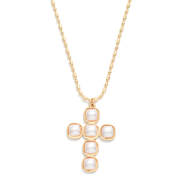 Pearl Cross Pendant Necklace featuring a cross formed from square faux pearl cabochons set in polished bezels, hung on a fine link chain. The soft luster gives a classic faith symbol an elegant, heirloom feel. Finished with a lobster clasp and extender. A beautiful gift for baptisms, first communions, and Christmas, and a standout piece for faith inspired displays.