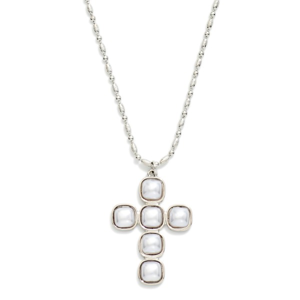 Pearl Cross Pendant Necklace featuring a cross formed from square faux pearl cabochons set in polished bezels, hung on a fine link chain. The soft luster gives a classic faith symbol an elegant, heirloom feel. Finished with a lobster clasp and extender. A beautiful gift for baptisms, first communions, and Christmas, and a standout piece for faith inspired displays.