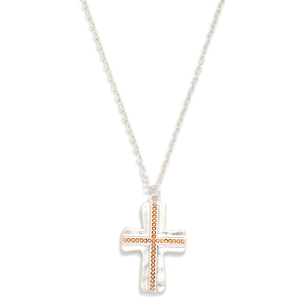 Textured Cross Pendant Necklace with a hammered cross pendant accented by a beaded inlay in a contrasting metal tone. The mixed metal detail adds depth and makes the piece easy to wear with any jewelry collection. Finished on a fine chain with a lobster clasp and extender. A thoughtful faith gift for baptisms, Easter, and Christmas, and a reliable year round seller for boutiques.