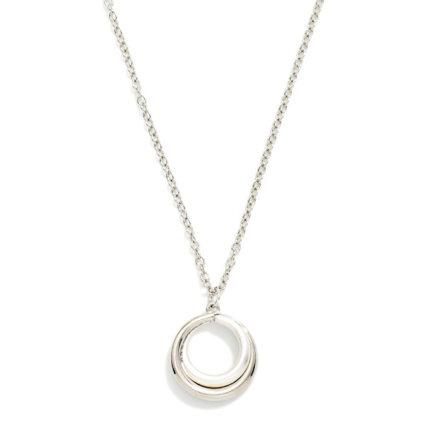 Organic Circle Pendant Necklace with a sculptural open ring pendant that has a soft, molten shape. Hung on a fine chain with a lobster clasp and extender, it adds subtle polish to everyday outfits. The minimalist design layers well with chokers and longer chains. A simple, modern piece at an easy price point that works as a self purchase or a thoughtful gift for any occasion.