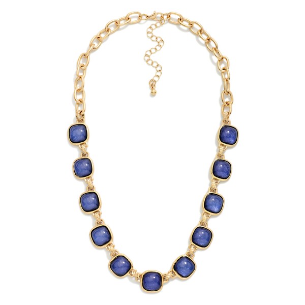 Square Stone Station Necklace featuring glossy square cabochon stones set in framed bezels and linked along a bold collar length chain. The rich stones give it a vintage inspired, heirloom feel that instantly elevates sweaters, button downs, and holiday dresses. Finished with a lobster clasp and extender chain. A statement piece at an accessible price, ideal for holiday parties, gifting, and boutique window displays.
