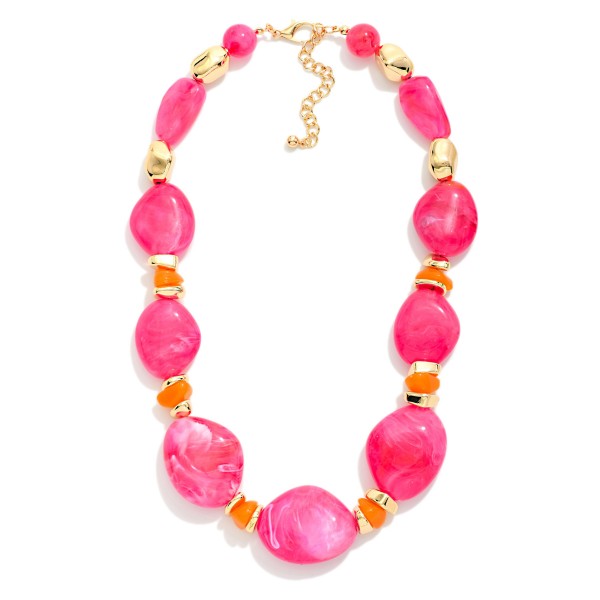 Chunky Resin Statement Necklace featuring graduated organic shaped beads with a glossy marbled finish, separated by faceted spacers and polished metal accents. Larger stones at the center create a bold focal point that elevates a plain tee, a cozy sweater, or a simple dress. Lightweight resin keeps it comfortable despite the bold scale, and an adjustable chain fits most necklines. Statement necklaces are a top add on sale, giving shoppers a quick outfit upgrade at a boutique friendly price.