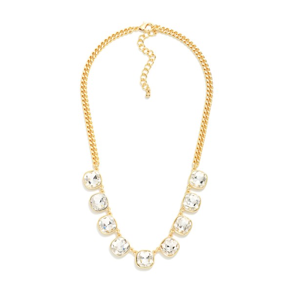 Cushion Cut Crystal Station Necklace featuring a row of faceted glass stones set in polished bezels along a classic curb chain. The stones catch light from every angle, adding just the right amount of sparkle to everyday outfits, holiday parties, and date nights. An adjustable extender lets it sit at the collarbone or slightly lower for layering. Sparkling stone necklaces are a perennial bestseller, and this one offers a polished, giftable look at an easy price point.