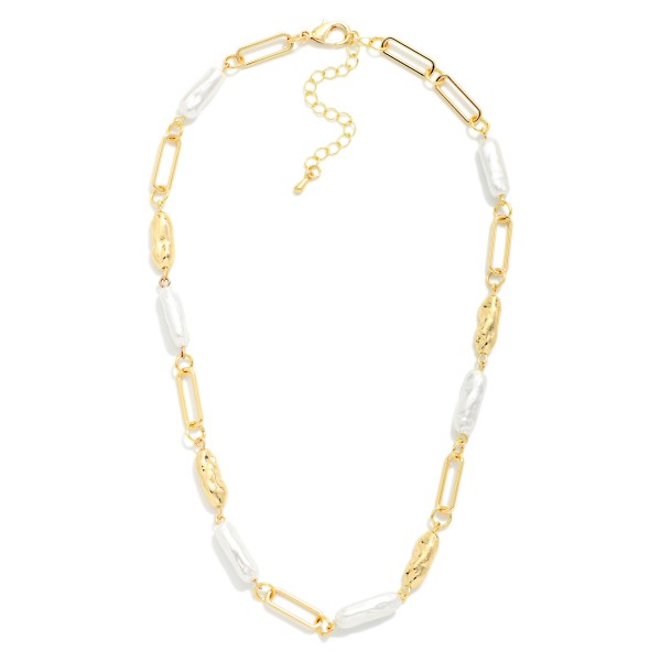 Pearl Station Chain Necklace with elongated faux pearls set between polished paperclip links. The mix of classic pearls and modern chain feels fresh, elegant, and easy to wear every day. Pairs beautifully with knits, blouses, and wedding season outfits. A timeless crossover style that appeals to both trendy and classic shoppers, making it a dependable seller year round.