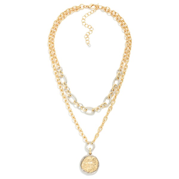 Triple Layered Coin Pendant Necklace combining a classic chain, a rhinestone accented link chain, and a vintage inspired coin medallion. The mixed textures and sparkle create a fully styled stack on a single clasp. A polished choice for holiday parties, work events, and dressing up jeans and a sweater. Coin jewelry continues to trend, and pre layered pieces like this give boutiques an easy, higher ticket sale.