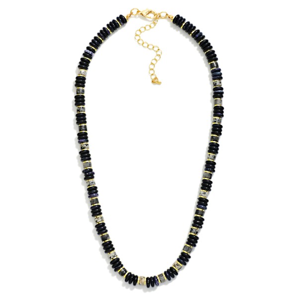 Disc Bead Necklace strung with glossy stacked rondelle beads and polished metal spacer accents for a modern take on the classic heishi look. The collar length strand sits neatly at the neckline and layers well with chains or pendants. A versatile everyday piece for weekend outfits, workwear, and travel. Easy to style and priced for impulse buys, beaded strands like this turn quickly in any boutique jewelry case.