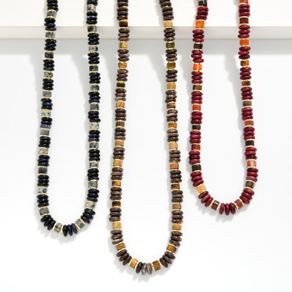 Disc Bead Necklace strung with glossy stacked rondelle beads and polished metal spacer accents for a modern take on the classic heishi look. The collar length strand sits neatly at the neckline and layers well with chains or pendants. A versatile everyday piece for weekend outfits, workwear, and travel. Easy to style and priced for impulse buys, beaded strands like this turn quickly in any boutique jewelry case.