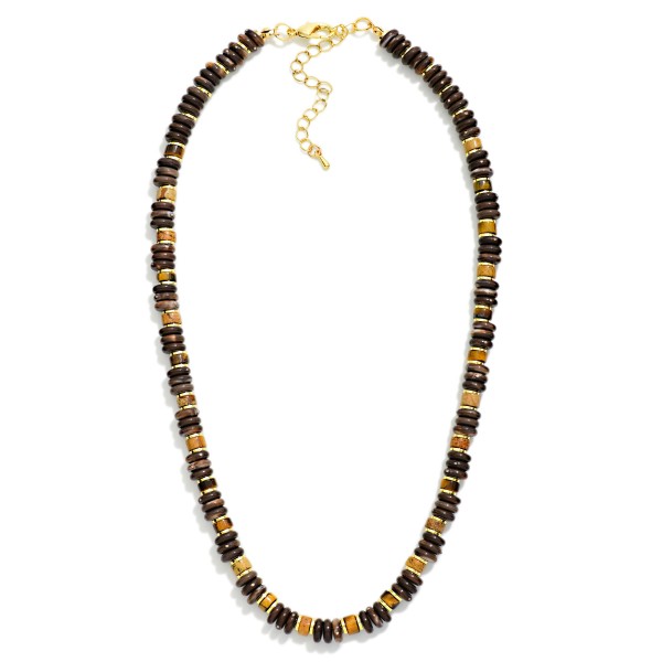Disc Bead Necklace strung with glossy stacked rondelle beads and polished metal spacer accents for a modern take on the classic heishi look. The collar length strand sits neatly at the neckline and layers well with chains or pendants. A versatile everyday piece for weekend outfits, workwear, and travel. Easy to style and priced for impulse buys, beaded strands like this turn quickly in any boutique jewelry case.