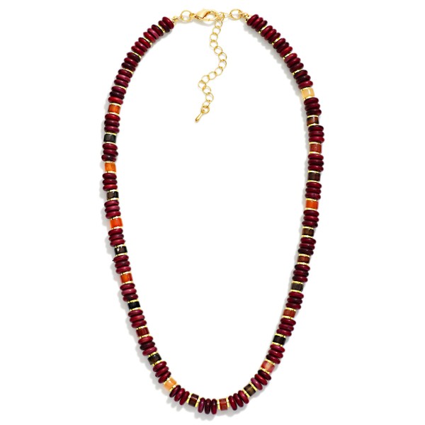 Disc Bead Necklace strung with glossy stacked rondelle beads and polished metal spacer accents for a modern take on the classic heishi look. The collar length strand sits neatly at the neckline and layers well with chains or pendants. A versatile everyday piece for weekend outfits, workwear, and travel. Easy to style and priced for impulse buys, beaded strands like this turn quickly in any boutique jewelry case.