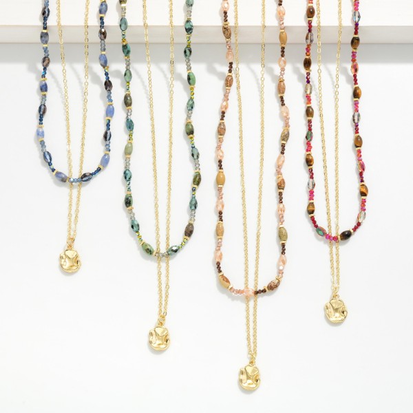 Layered Bead and Chain Necklace combining a strand of petite stone look beads with a fine chain and a tiny disc charm. Both layers share one clasp, so customers get a perfectly styled stack without any tangling. Easy to wear with everything from tees to sweaters for a polished, collected look. Pre layered necklaces are a consistent boutique best seller and an easy add on at checkout.
