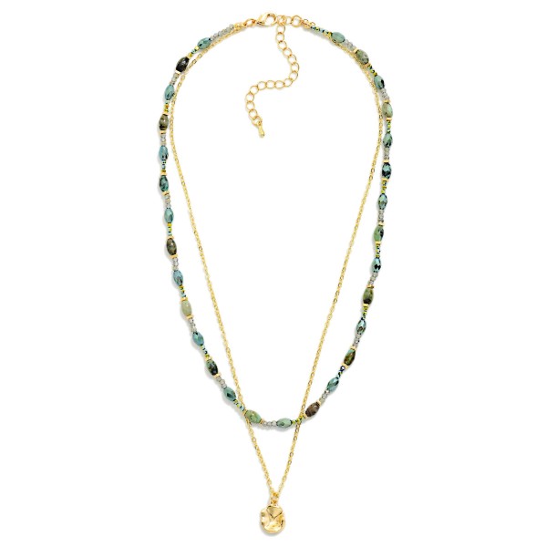 Layered Bead and Chain Necklace combining a strand of petite stone look beads with a fine chain and a tiny disc charm. Both layers share one clasp, so customers get a perfectly styled stack without any tangling. Easy to wear with everything from tees to sweaters for a polished, collected look. Pre layered necklaces are a consistent boutique best seller and an easy add on at checkout.