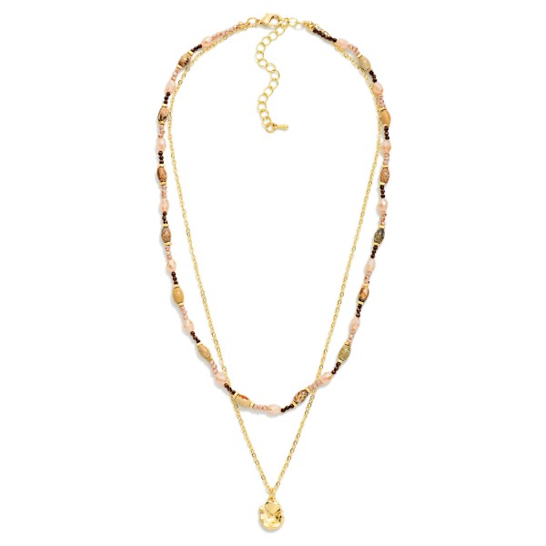 Layered Bead and Chain Necklace combining a strand of petite stone look beads with a fine chain and a tiny disc charm. Both layers share one clasp, so customers get a perfectly styled stack without any tangling. Easy to wear with everything from tees to sweaters for a polished, collected look. Pre layered necklaces are a consistent boutique best seller and an easy add on at checkout.