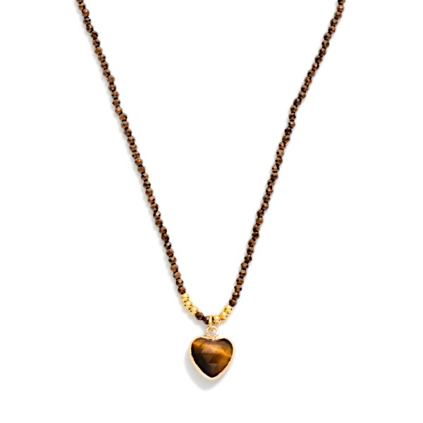 Seed Bead Heart Pendant Necklace with a twisted strand of tiny glass seed beads finished by a faceted heart pendant in a polished bezel. The slim, textured strand adds dimension while staying light enough for everyday wear. Lovely layered with dainty chains or worn alone with tees, knits, and casual dresses. A sweet, giftable style that works for Valentine gifts, birthdays, and everyday treats, so it sells all year.