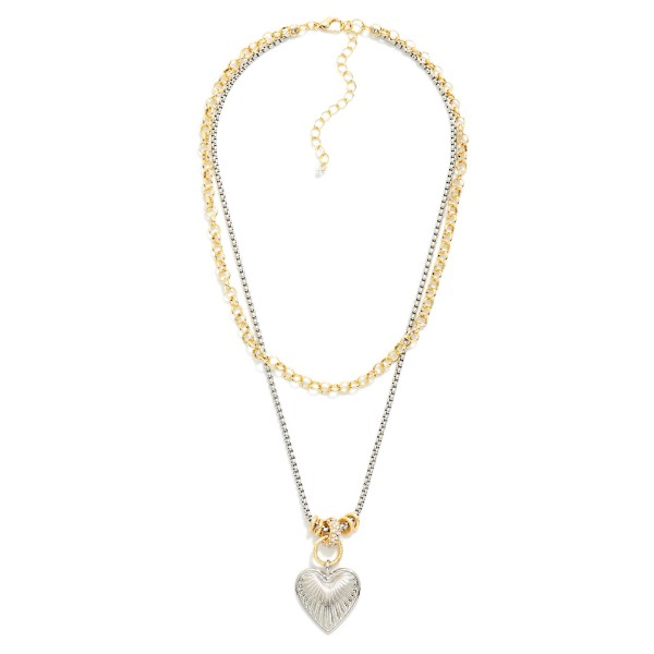 Two Tone Layered Heart Pendant Necklace pairing a classic link chain with a sleek box chain and a puffed heart pendant. The mixed metal finish makes it easy to wear with any jewelry a customer already owns. A sweet everyday layer for date nights, weekend outfits, and Valentine gifting. Pre layered styles save shoppers time getting dressed and are reliable sellers all year long.
