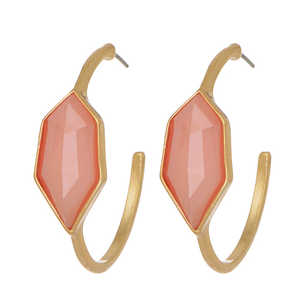 Gold tone bangle style post earrings featuring a pink tone cabochon.