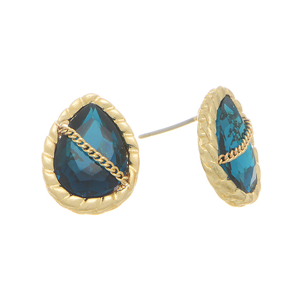 Gold tone post earrings featuring a teardrop shaped teal glass stone wrapped with a chain. 