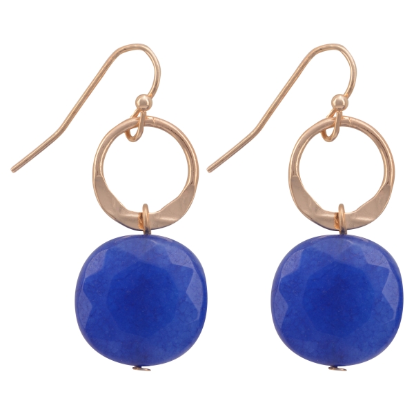 Gold tone fishhook earrings featuring a hammered ring with a hanging royal blue natural stone. Approximately 1 1/16" in length.