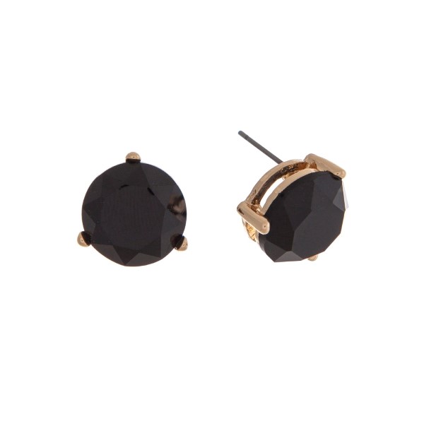 Gold tone post earrings with a round faceted black stone. Approximately 1/2" in length.