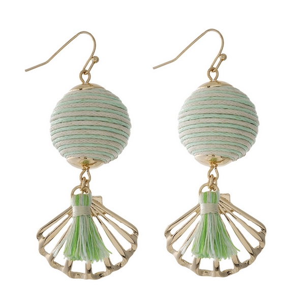 Gold tone fishhook earrings with a mint green and ivory thread wrapped ball bead and a seashell charm. Approximately 2" in length. 