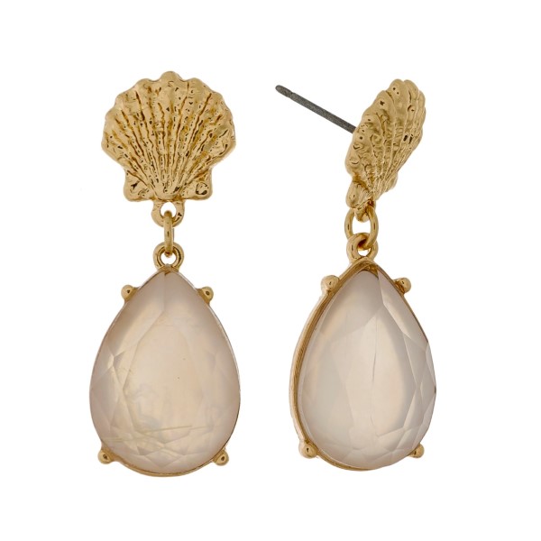 Seashell stud earrings with a mother of pearl teardrop rhinestone. Approximately 1" in length. 