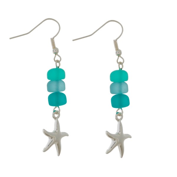 Silver tone fishhook earrings with sea glass beads and a sea life charm. Approximately 1.5" in length. 