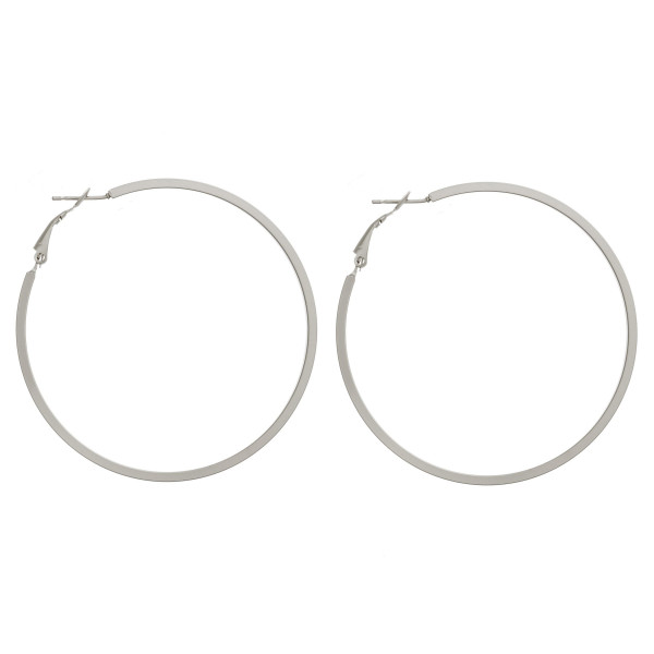 Large matte hoop earrings. Approximately 2.5" in diameter.