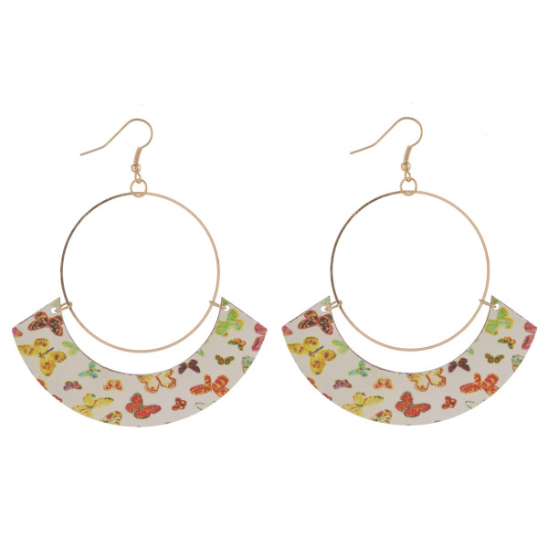 Large circular drop earrings featuring a wood inspired accent with butterfly details. Approximately 3" in length.