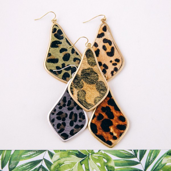 Leopard print faux fur encased arabesque drop earrings. Approximately 2.5" in length.