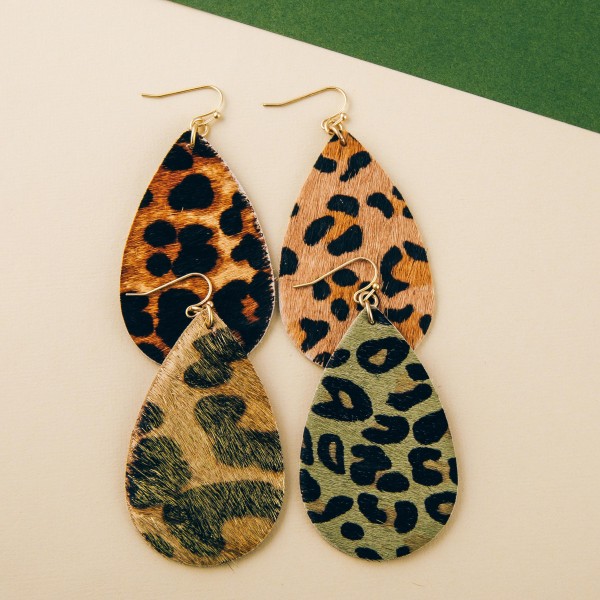 Leopard print cowhide teardrop earrings. 

- Approximately 2.5" in length