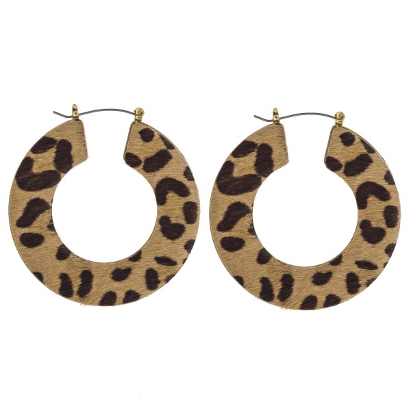 Leopard print cowhide flat pin catch hoop earrings. 

- Approximately 2" in diameter