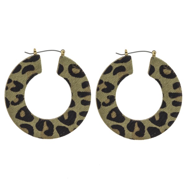 Leopard print cowhide flat pin catch hoop earrings. 

- Approximately 2" in diameter