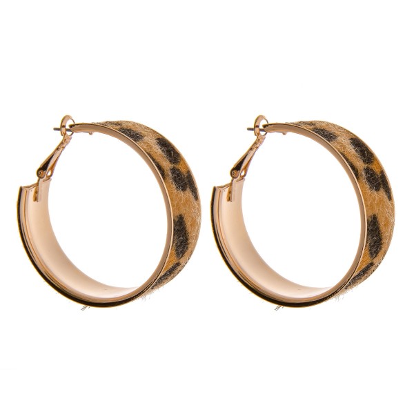 Faux fur cheetah print metal hoop earrings. 

- Approximately 1.5"  in diameter
- Approximately .5" wide