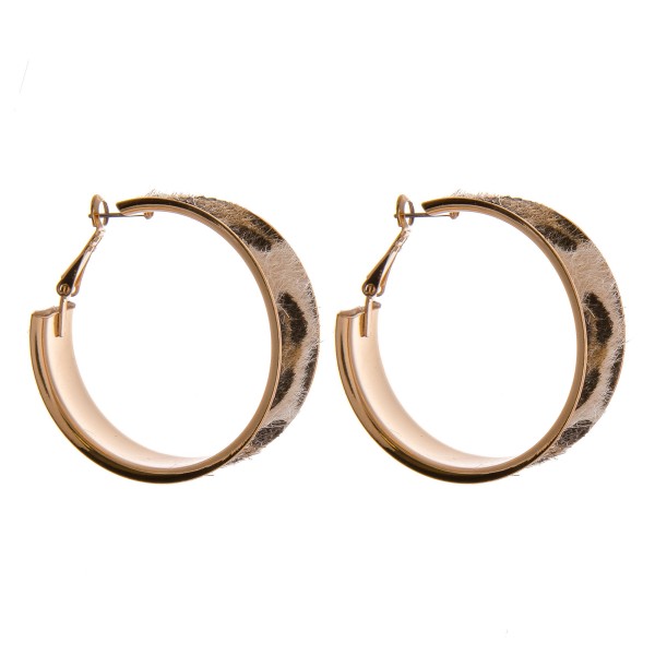 Faux fur leopard print metal hoop earrings. 

- Approximately 1.5"  in diameter
- Approximately .5" wide