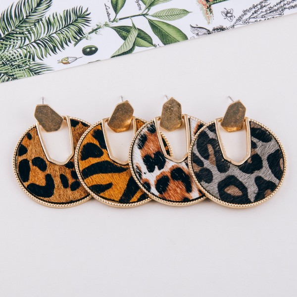 Cowhide leopard print encased drop disc earrings.

- Approximately 2" in diameter