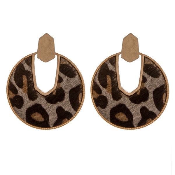Cowhide leopard print encased drop disc earrings.

- Approximately 2" in diameter