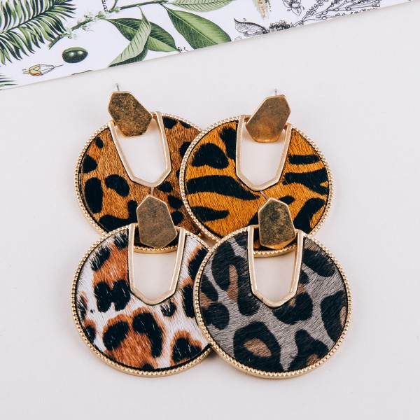 Cowhide leopard print encased drop disc earrings.

- Approximately 2" in diameter