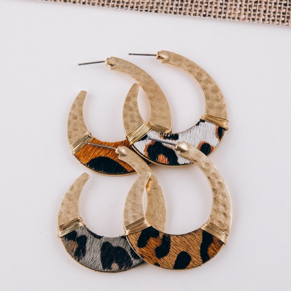Cowhide leopard print hammered j-hoop earrings with wire wrapped details.

- Approximately 2" in length