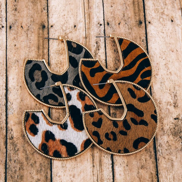 Cowhide leopard print encased open hoop disc earrings.

- Approximately 2" in diameter