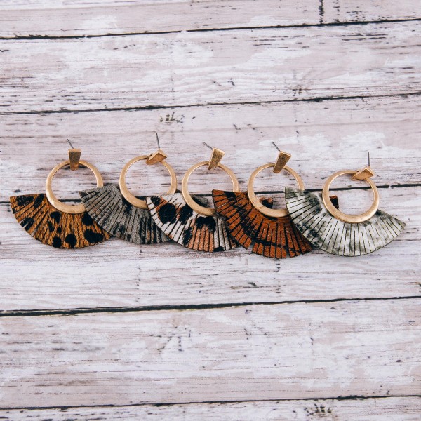 Cowhide leopard print faux leather tassel earrings.

- Approximately 2" in length