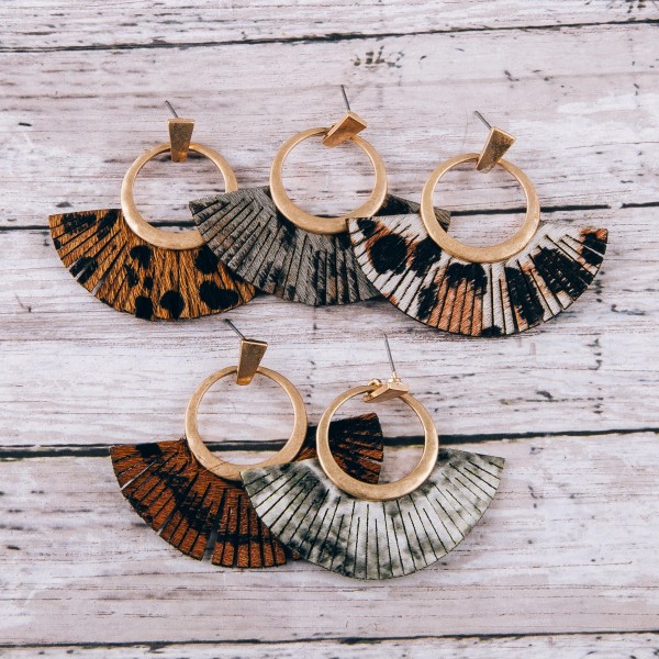Cowhide leopard print faux leather tassel earrings.

- Approximately 2" in length