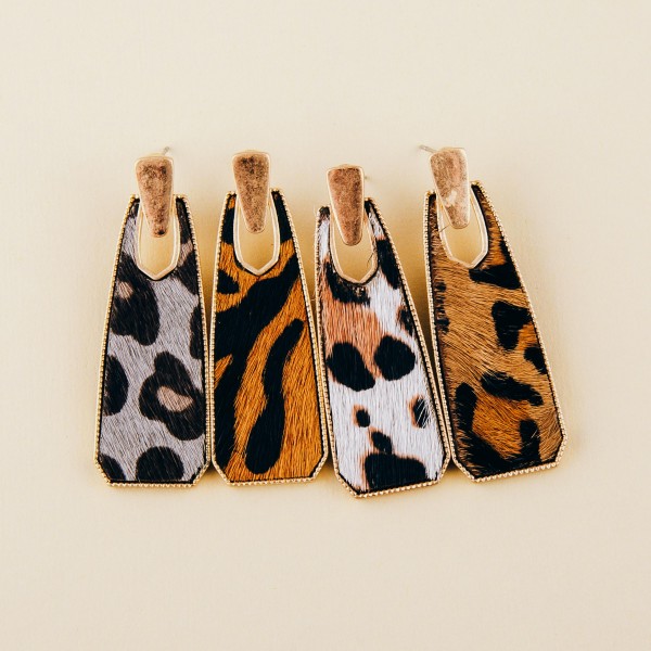 Cowhide encased leopard print oblong earrings.

- Approximately 2" in length