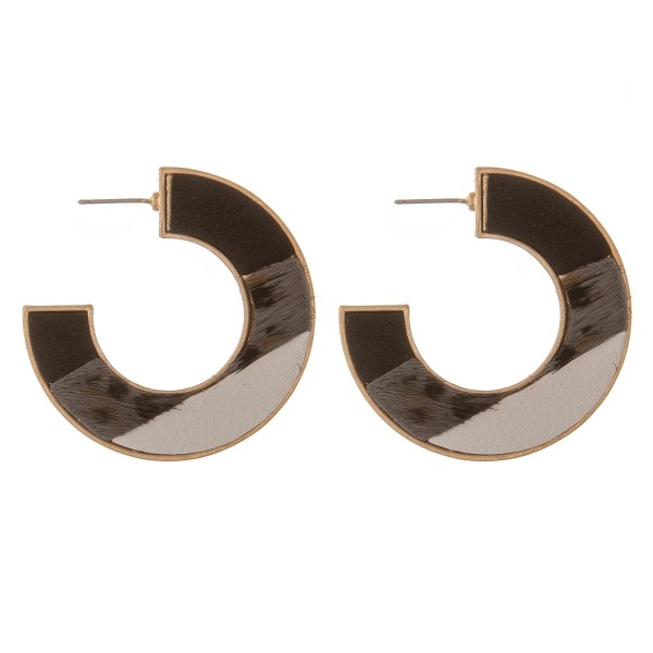Multi faux leather leopard print encased hoop earrings.

- Approximately 1.75" in diameter