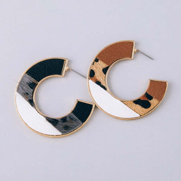 Multi faux leather leopard print encased hoop earrings.

- Approximately 1.75" in diameter